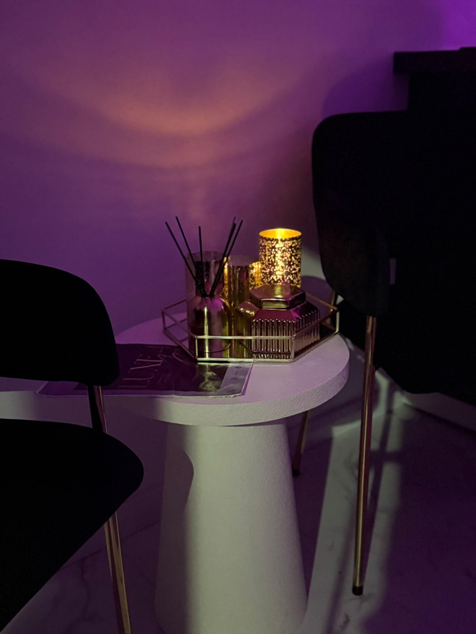 The Luxe 4 You treatment room in Sheffield under warm purple lighting